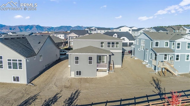 rear view of house with a mountain view