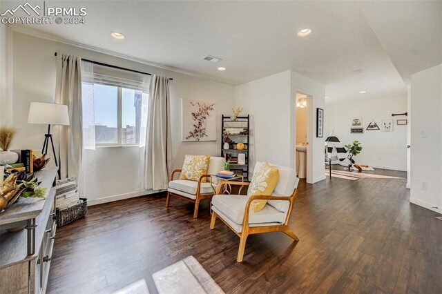 living area featuring dark hardwood / wood-style floors