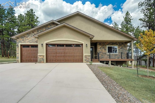 view of front of home with a front yard and a garage