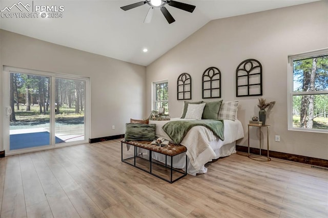 bedroom featuring vaulted ceiling, multiple windows, and ceiling fan