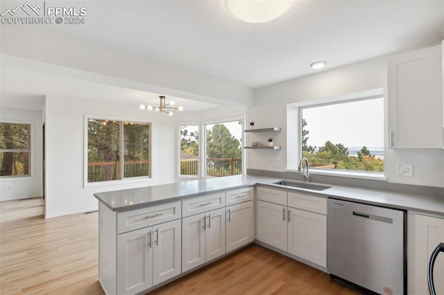 kitchen with white cabinetry, dishwasher, a healthy amount of sunlight, and sink