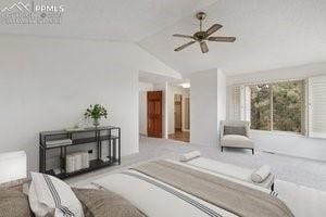 bedroom featuring lofted ceiling, light colored carpet, and ceiling fan