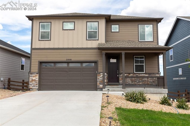 view of front of house featuring covered porch and a garage