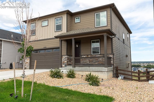 craftsman house with a garage and covered porch