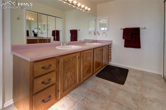 bathroom featuring vanity and tile patterned flooring