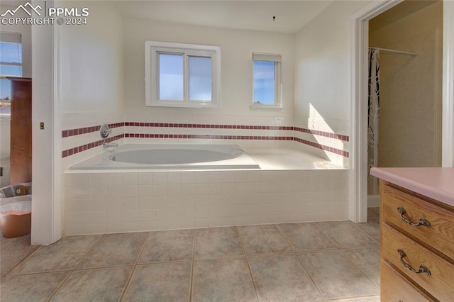 bathroom with vanity, shower with separate bathtub, and tile patterned floors