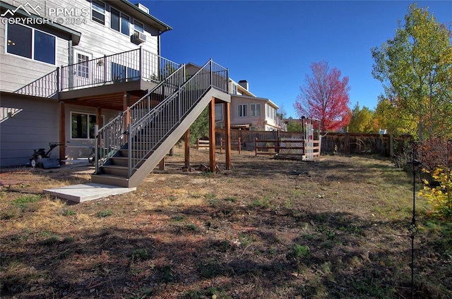 view of yard with a deck and cooling unit