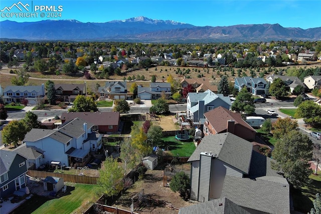 birds eye view of property with a mountain view