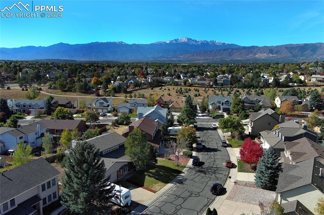 birds eye view of property with a mountain view