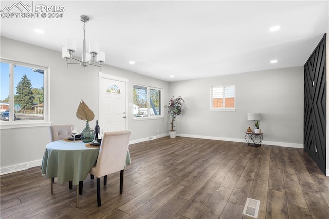 dining space with a chandelier, dark hardwood / wood-style flooring, and a healthy amount of sunlight