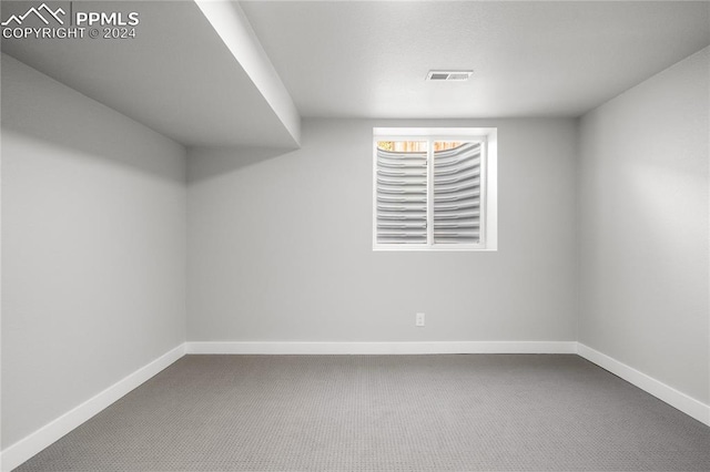 unfurnished room with carpet flooring