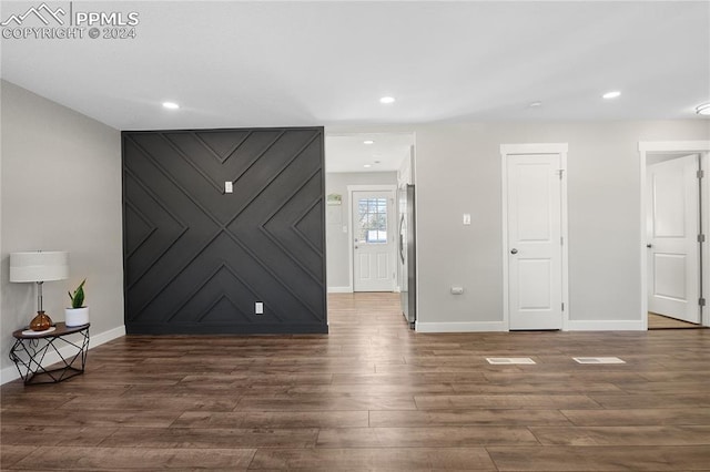 unfurnished room featuring dark hardwood / wood-style flooring