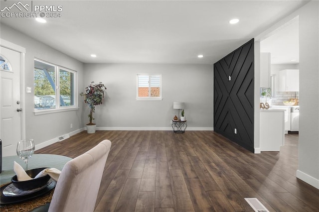 sitting room featuring dark hardwood / wood-style flooring and a wealth of natural light