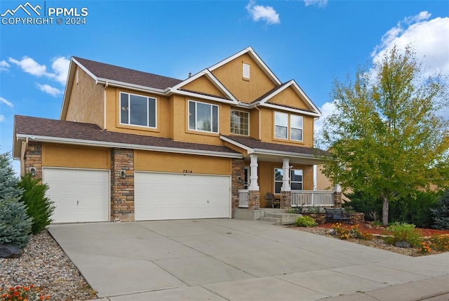 craftsman-style home featuring a porch and a garage