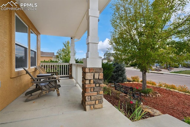 view of patio featuring a porch