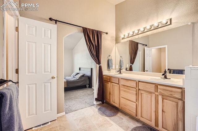 bathroom with vanity and a textured ceiling