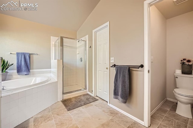 bathroom featuring toilet, vaulted ceiling, and shower with separate bathtub