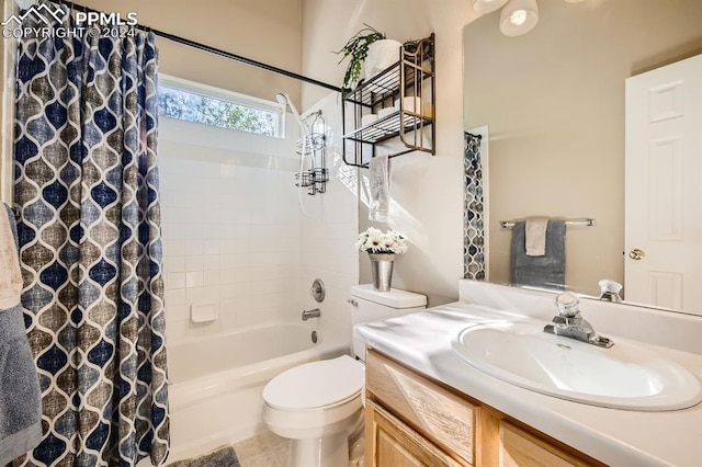 full bathroom featuring vanity, shower / tub combo, toilet, and tile patterned floors