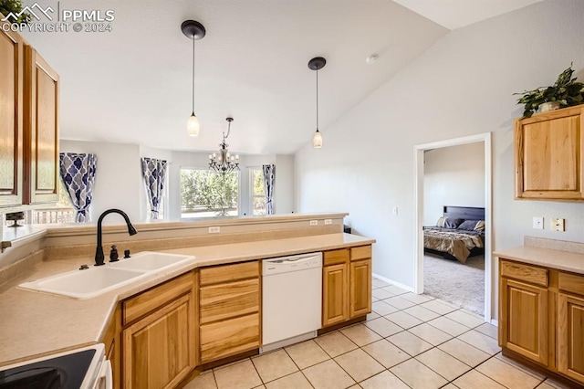 kitchen with white appliances, sink, hanging light fixtures, light tile patterned floors, and a chandelier