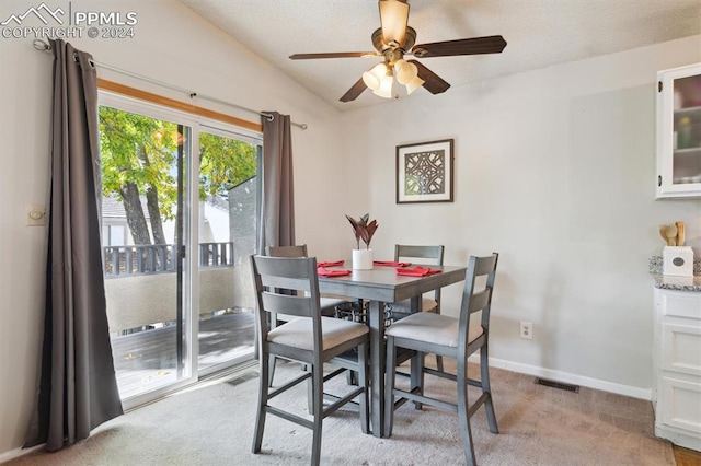 dining room featuring light carpet and ceiling fan