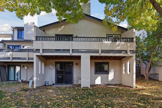 rear view of house with a balcony