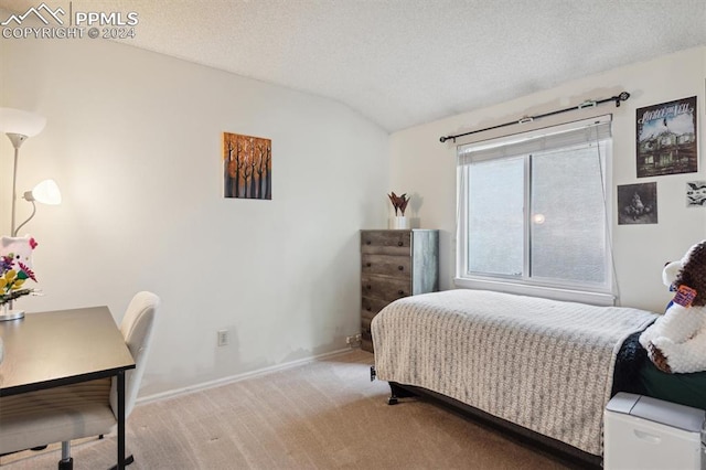 bedroom featuring light carpet, a textured ceiling, and vaulted ceiling