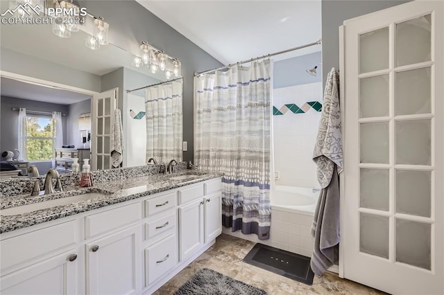 bathroom featuring vanity and shower / bath combination with curtain