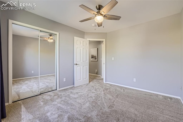 unfurnished bedroom with light carpet, a closet, and ceiling fan