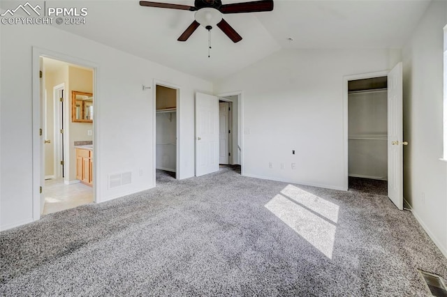 unfurnished bedroom featuring ceiling fan, lofted ceiling, and light carpet