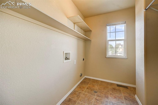 washroom with electric dryer hookup and washer hookup