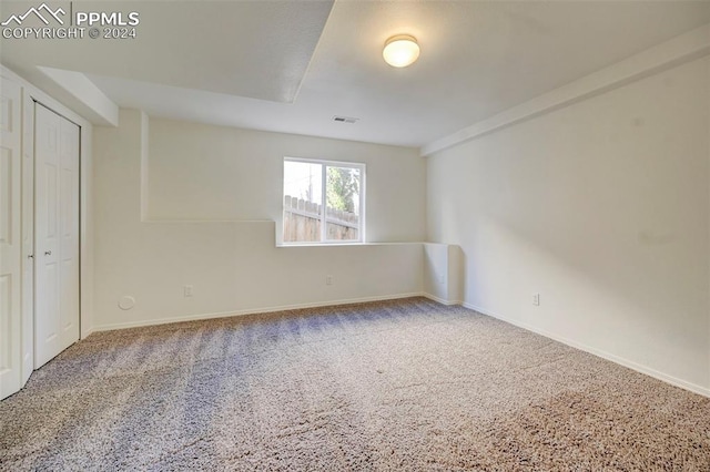 empty room featuring carpet flooring