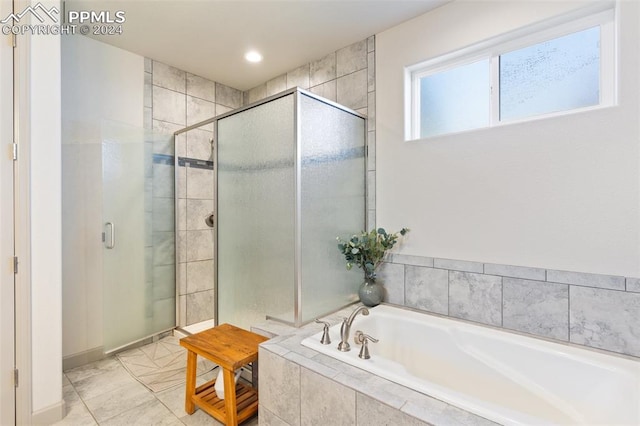 bathroom featuring plus walk in shower