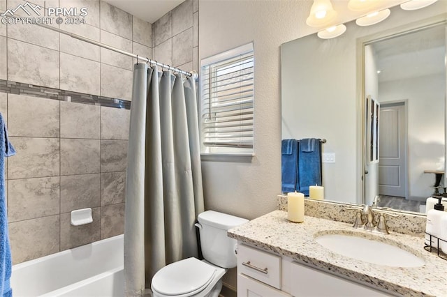 full bathroom featuring vanity, toilet, and shower / tub combo