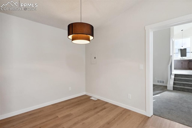 unfurnished dining area featuring hardwood / wood-style flooring