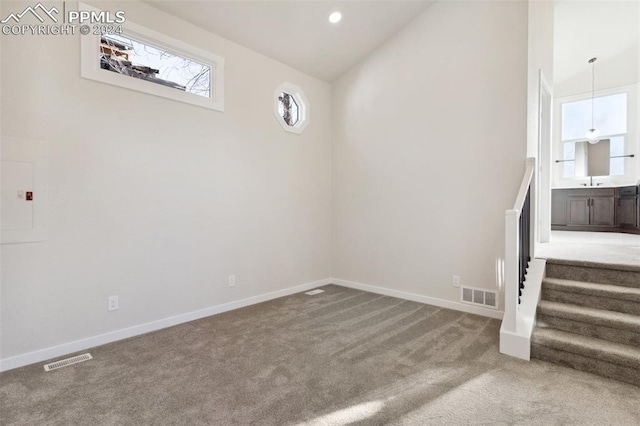 basement with carpet and electric panel