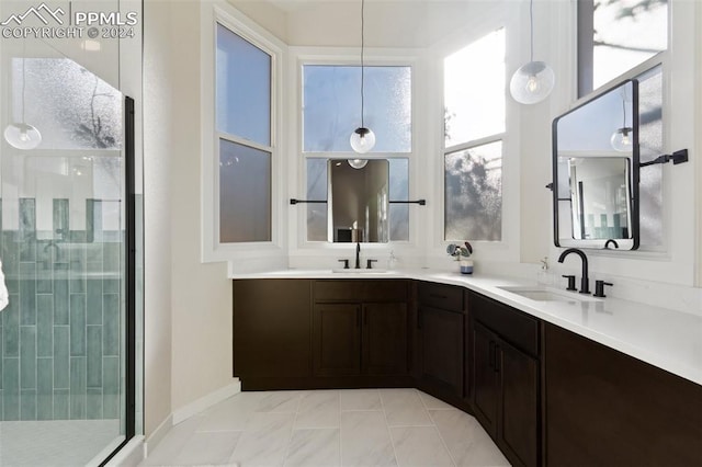 bathroom featuring vanity and an enclosed shower