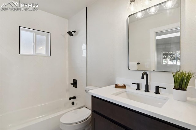 full bathroom with vanity, toilet, and tiled shower / bath