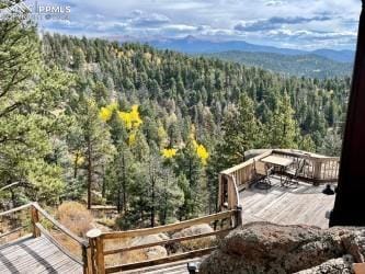 wooden deck featuring a mountain view