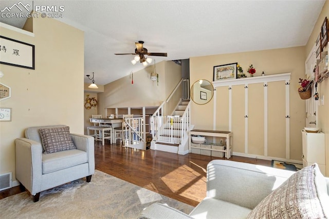 living room featuring hardwood / wood-style floors and ceiling fan