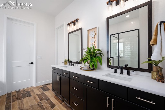 bathroom featuring vanity, hardwood / wood-style flooring, and walk in shower