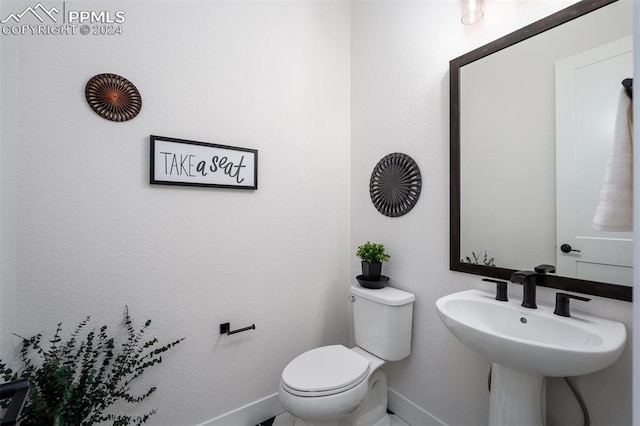 bathroom with sink and toilet