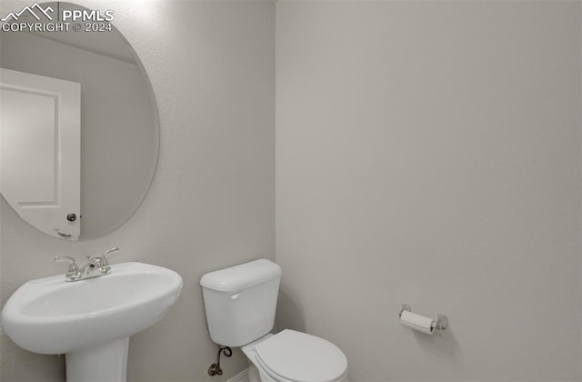 bathroom with sink and toilet