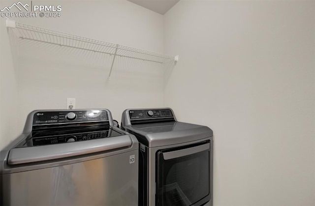 clothes washing area featuring washing machine and clothes dryer