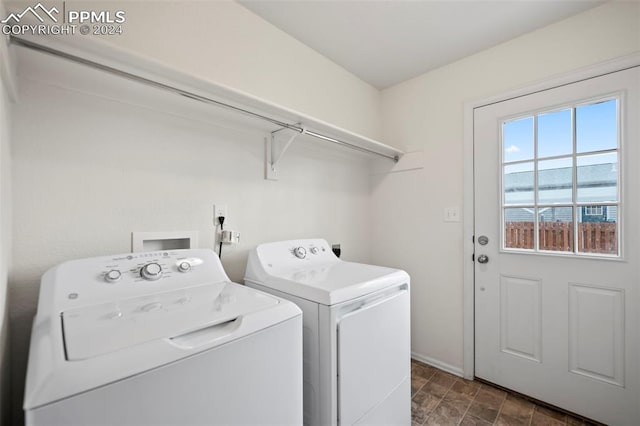 clothes washing area with washing machine and dryer