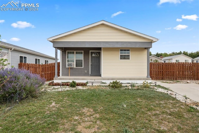 view of front of property with a front lawn