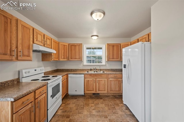 kitchen featuring white appliances and sink