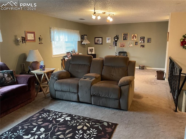 carpeted living room featuring rail lighting and a textured ceiling