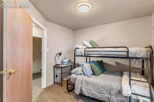 bedroom featuring light colored carpet