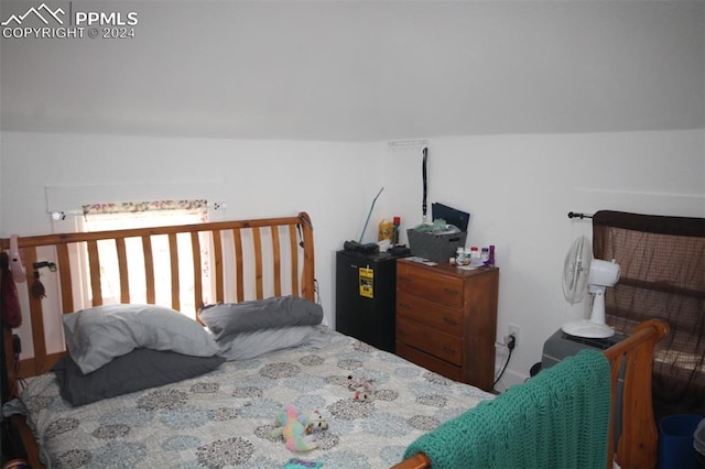 bedroom featuring vaulted ceiling