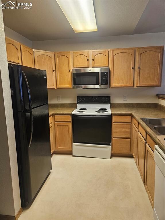 kitchen featuring sink and white appliances